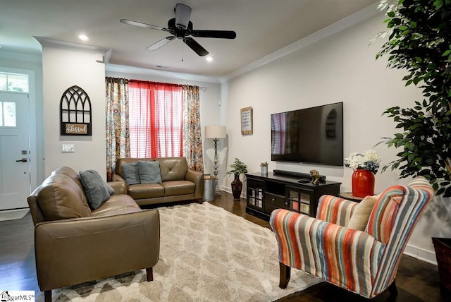 living room with crown molding, ceiling fan, and dark hardwood / wood-style flooring