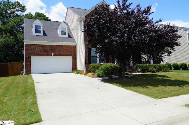 view of front facade with a front lawn and a garage