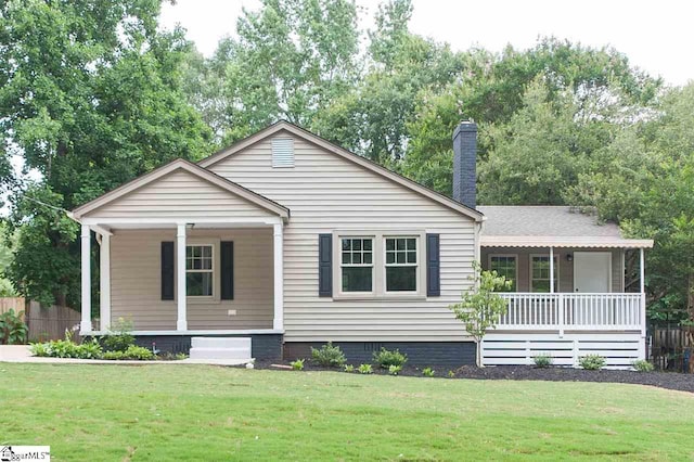 view of front of house with a front lawn and a porch