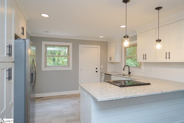 kitchen featuring white cabinets, hanging light fixtures, a healthy amount of sunlight, and stainless steel appliances