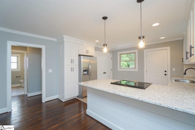 kitchen featuring white cabinetry, stainless steel fridge, hanging light fixtures, dark hardwood / wood-style floors, and light stone counters