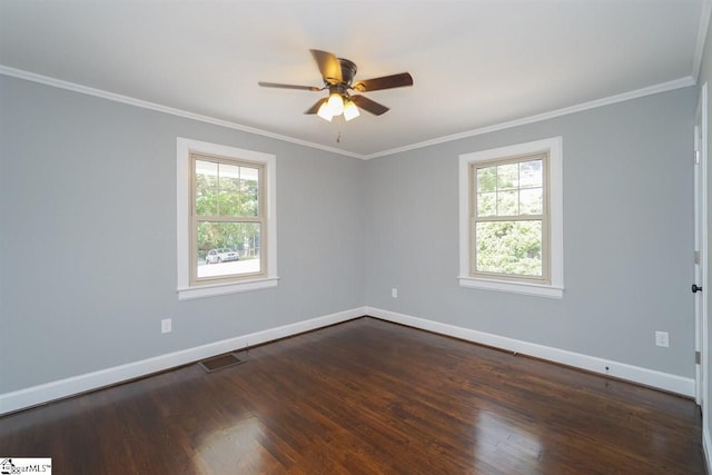 empty room featuring dark hardwood / wood-style flooring, ceiling fan, and a healthy amount of sunlight