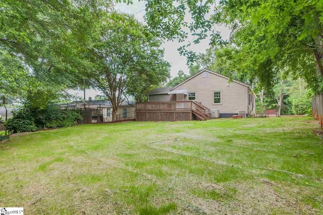 view of yard with a wooden deck