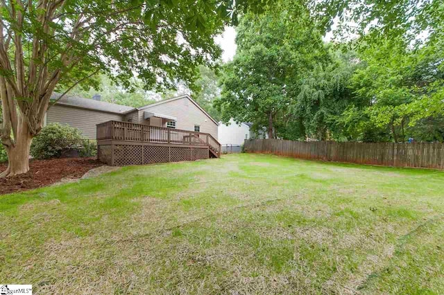 view of yard featuring a wooden deck