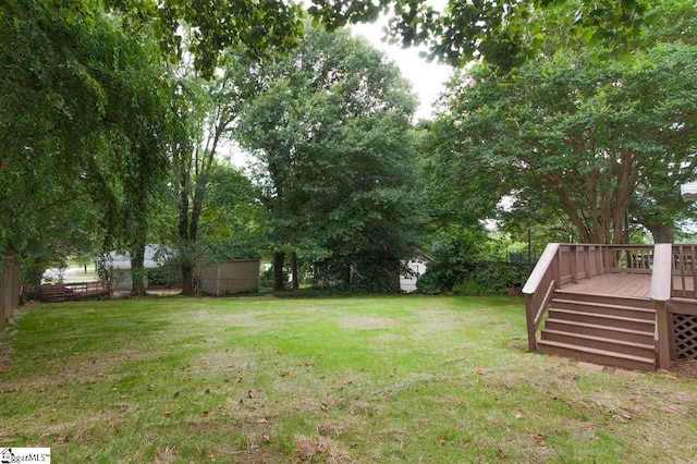 view of yard featuring a deck