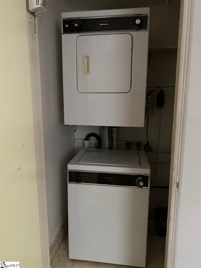 laundry area featuring hookup for an electric dryer and stacked washer / dryer