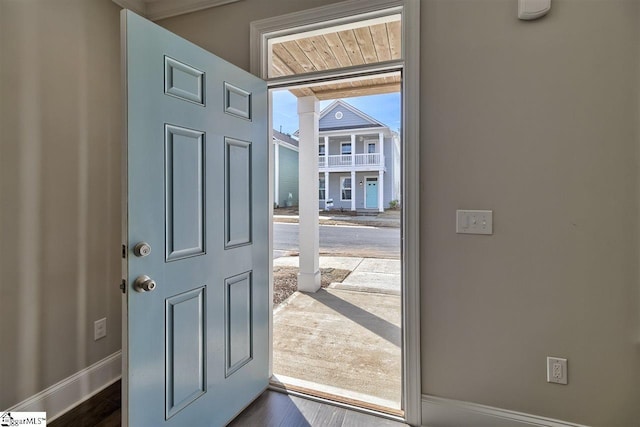 doorway to outside featuring dark wood-type flooring