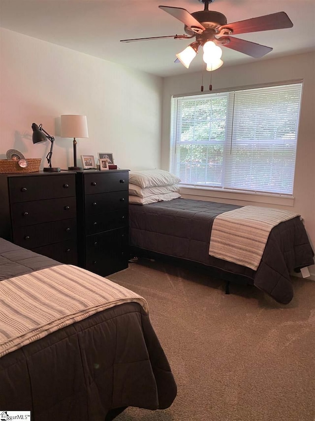 bedroom with light carpet and ceiling fan