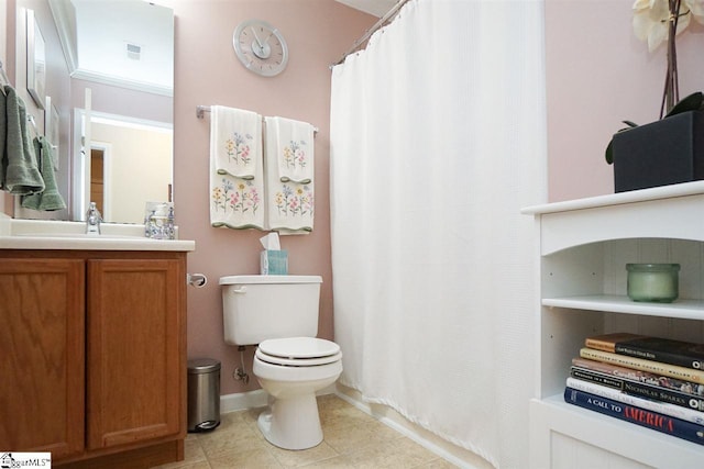 bathroom featuring tile floors, toilet, and vanity