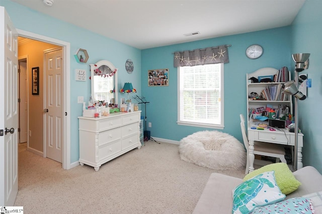 bedroom featuring light colored carpet