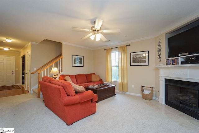 living room featuring light hardwood / wood-style floors, ceiling fan, and ornamental molding