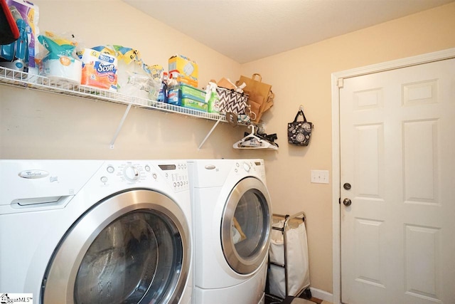 clothes washing area featuring washing machine and dryer