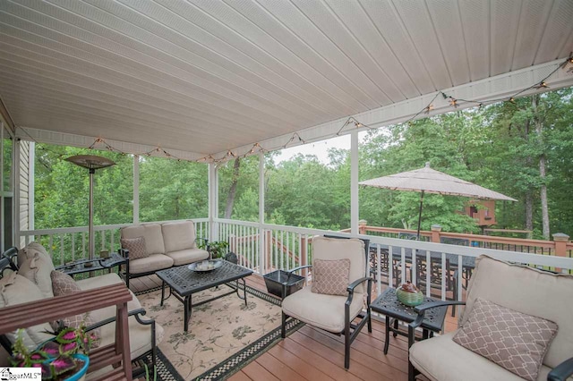 wooden deck with an outdoor hangout area