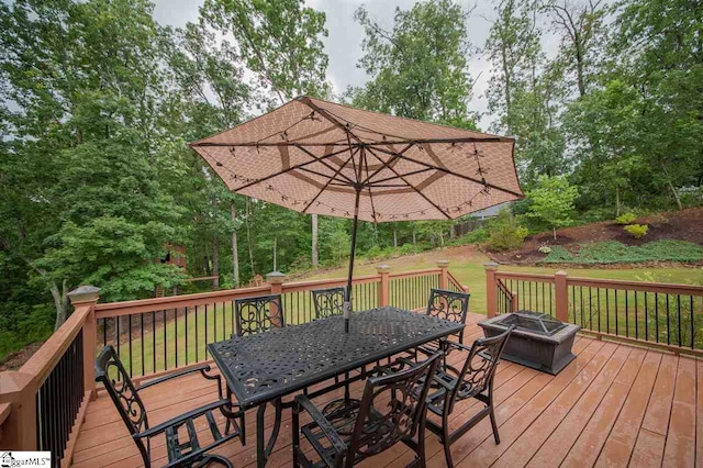 wooden terrace with a lawn