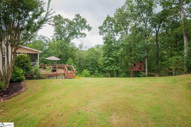 view of yard featuring a wooden deck