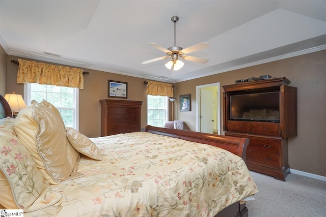 bedroom featuring light colored carpet, ceiling fan, multiple windows, and crown molding