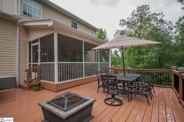 wooden deck with an outdoor fire pit