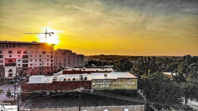 view of outdoor building at dusk