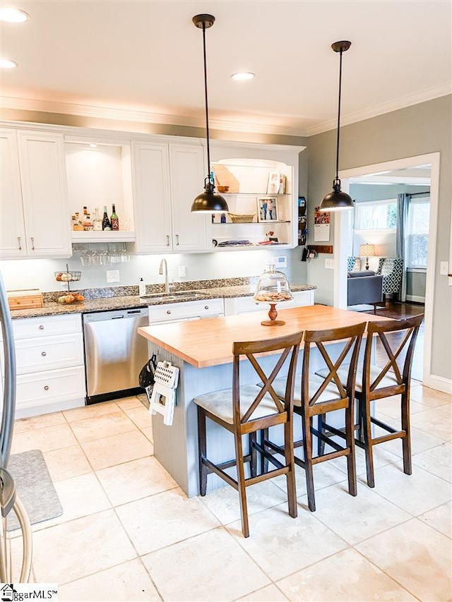 kitchen with dishwasher, white cabinetry, ornamental molding, and pendant lighting