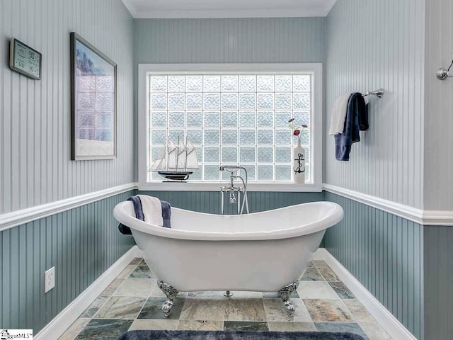 bathroom with a bathtub and tile flooring