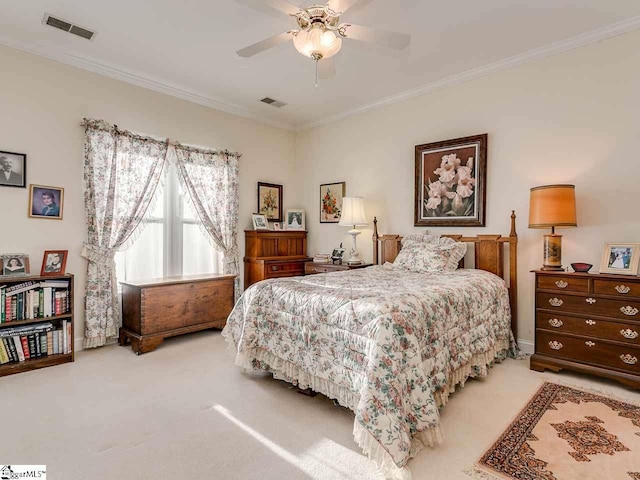 carpeted bedroom with crown molding and ceiling fan