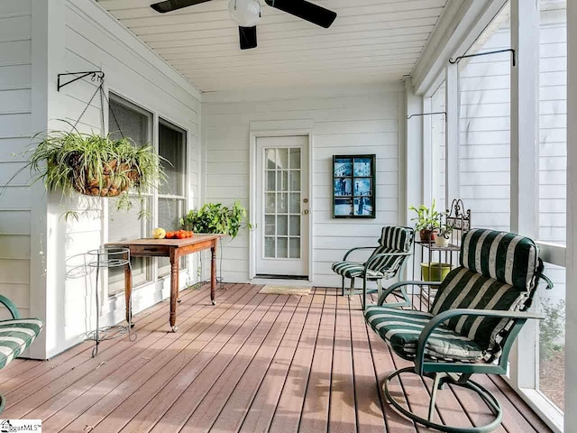 sunroom / solarium with plenty of natural light and ceiling fan