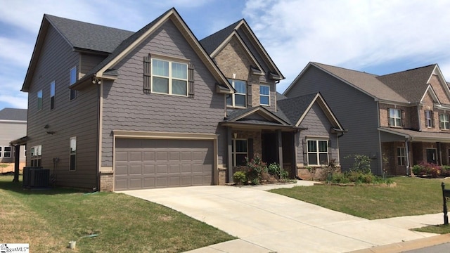 craftsman inspired home with central AC, a front yard, and a garage