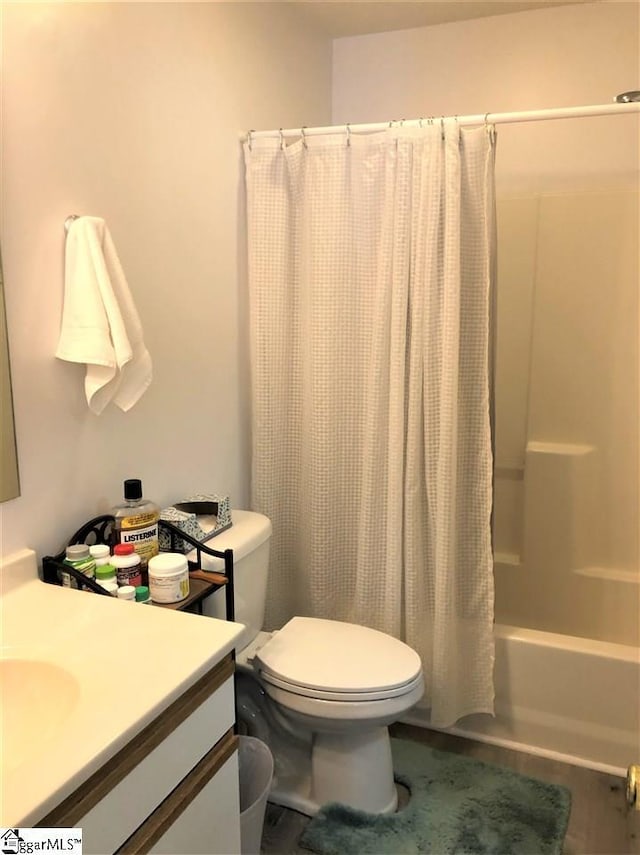 full bathroom with vanity, toilet, and shower / bathtub combination with curtain