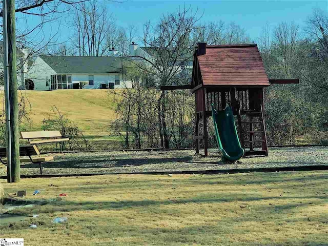 view of jungle gym with a lawn