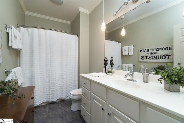 bathroom with tile flooring, ornamental molding, toilet, and vanity with extensive cabinet space