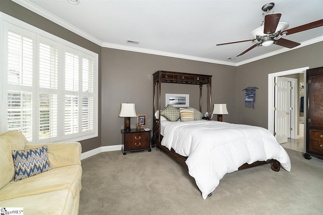 carpeted bedroom featuring ceiling fan and ornamental molding