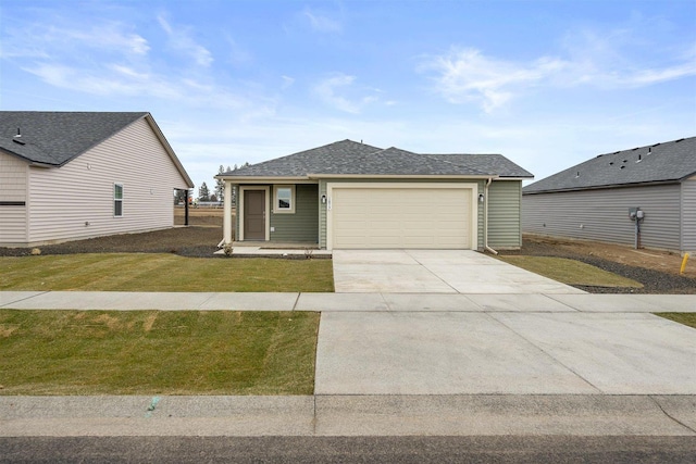 view of front of house featuring a garage and a front yard