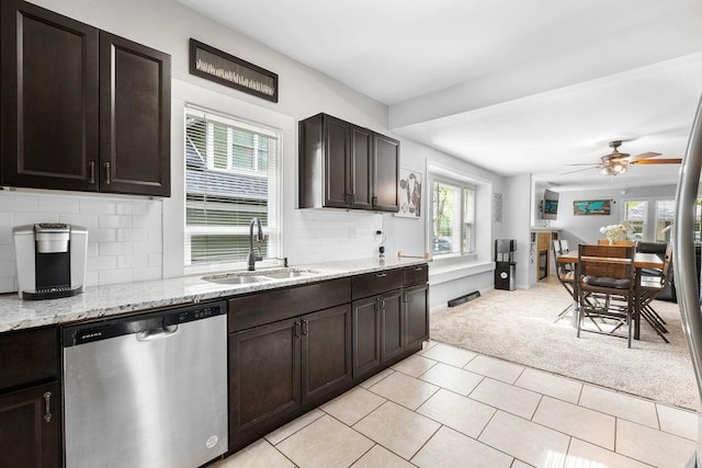 kitchen with backsplash, plenty of natural light, ceiling fan, and dishwasher