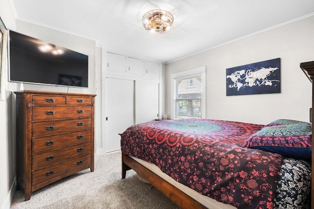 carpeted bedroom featuring ornamental molding