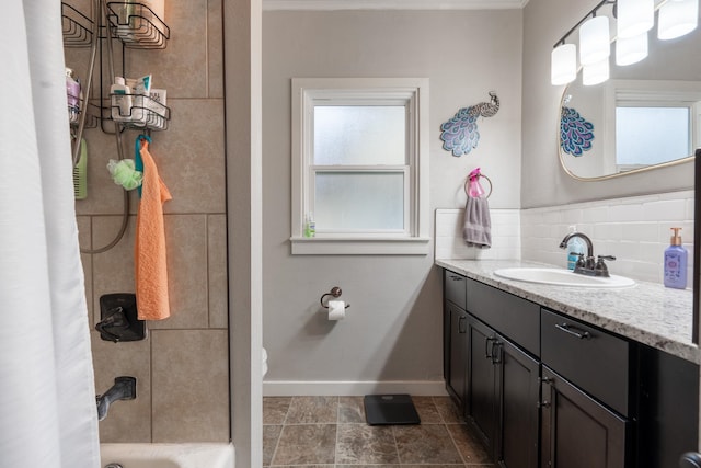 bathroom featuring tasteful backsplash, tile flooring, shower / bath combination, and large vanity