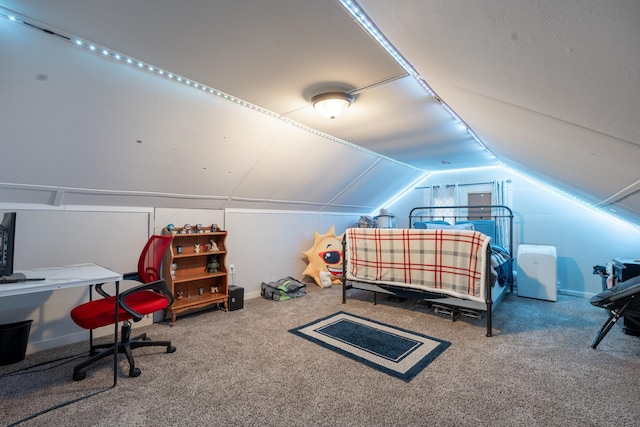 bedroom featuring carpet and vaulted ceiling