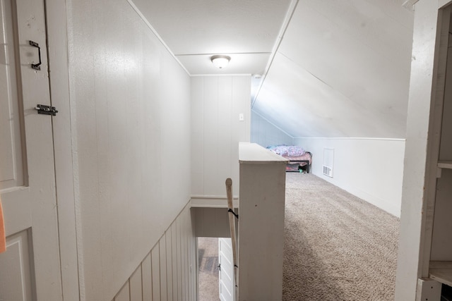 bonus room with lofted ceiling and carpet