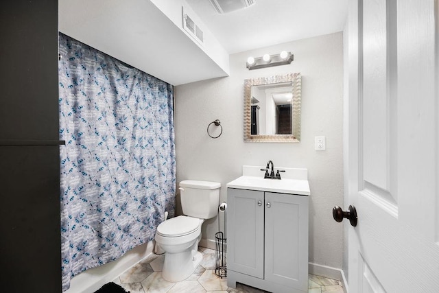 full bathroom featuring vanity, toilet, tile floors, and shower / bath combo with shower curtain