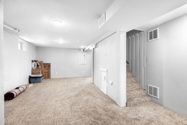 basement with light colored carpet