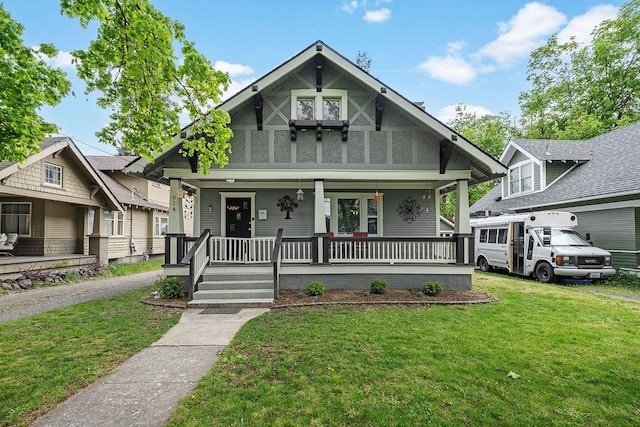 view of front of home featuring a front yard and a porch