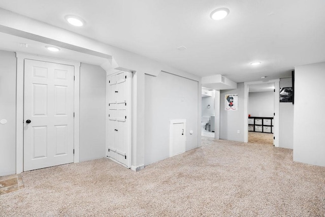 basement with light carpet