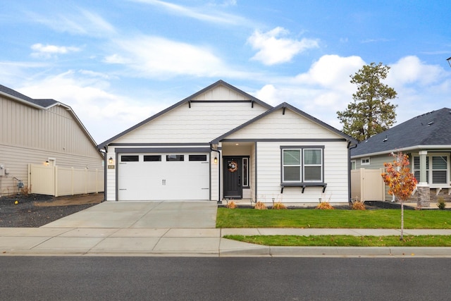 view of front facade with a garage and a front lawn