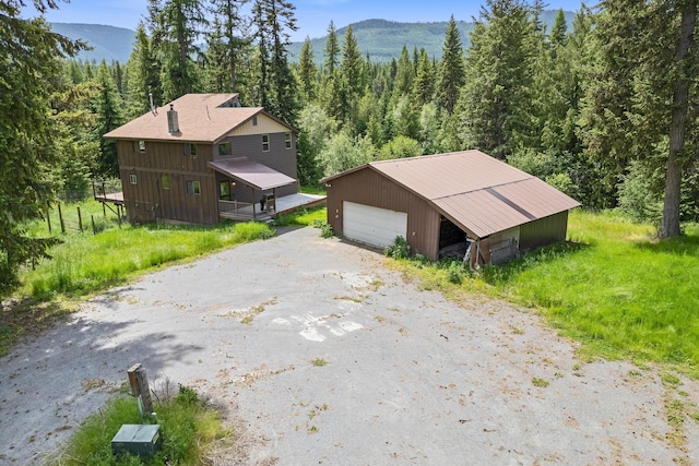 birds eye view of property featuring a mountain view