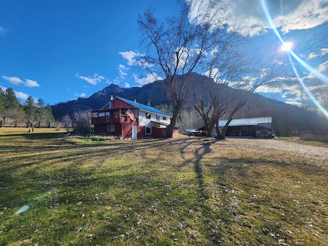 view of mountain feature with a rural view