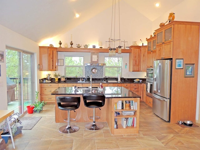 35025 Mourning Dove Ln N, Davenport, WA 99122 - kitchen with stainless steel appliances, a kitchen breakfast bar, open shelves, a center island with sink, and glass insert cabinets