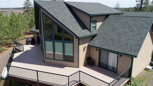 35025 Mourning Dove Ln N, Davenport, WA 99122 - back of house with a wooden deck and a shingled roof