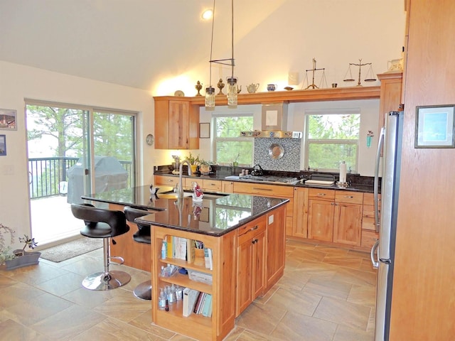 35025 Mourning Dove Ln N, Davenport, WA 99122 - kitchen with stainless steel appliances, high vaulted ceiling, open shelves, an island with sink, and a kitchen breakfast bar