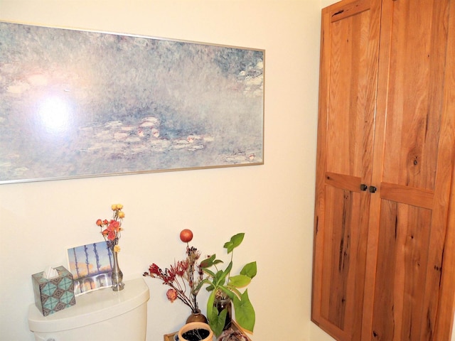 bathroom featuring a wealth of natural light, shower with separate bathtub, and toilet