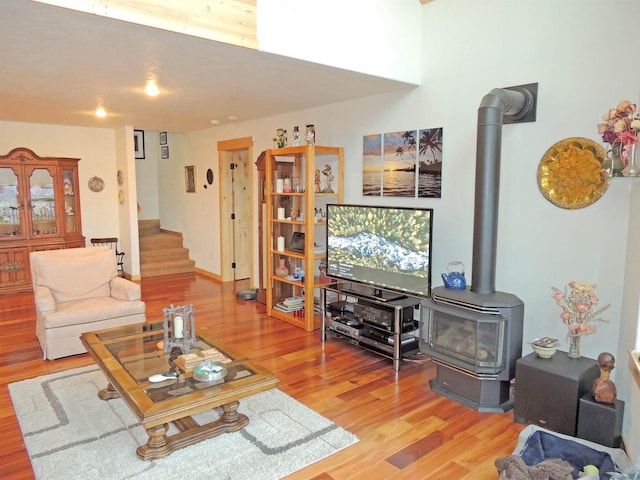 35025 Mourning Dove Ln N, Davenport, WA 99122 - living area with stairway, light wood-type flooring, and a wood stove