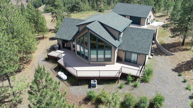 35025 Mourning Dove Ln N, Davenport, WA 99122 - back of house featuring roof with shingles, a wooden deck, and an outdoor structure